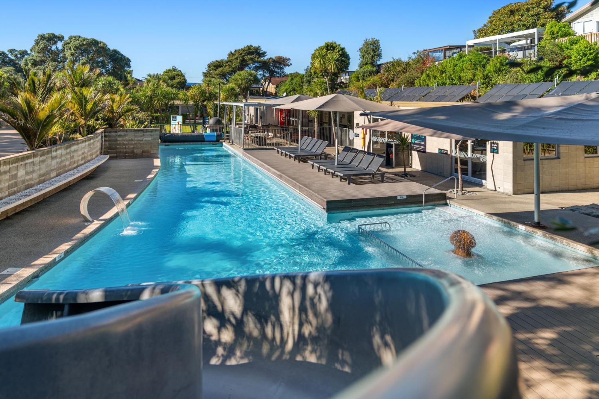 Tasman Holiday Parks - Waihi Beach Экстерьер фото The pool at the Bay of Many Coves