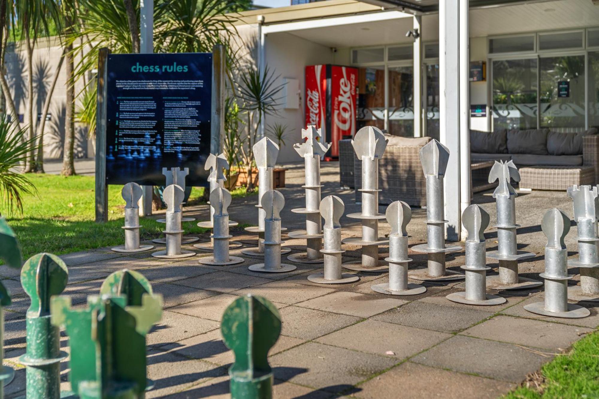 Tasman Holiday Parks - Waihi Beach Экстерьер фото Chess set at the entrance of the library